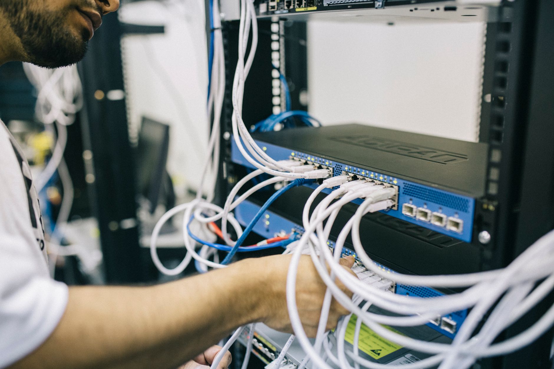 technician plugging wearable into server